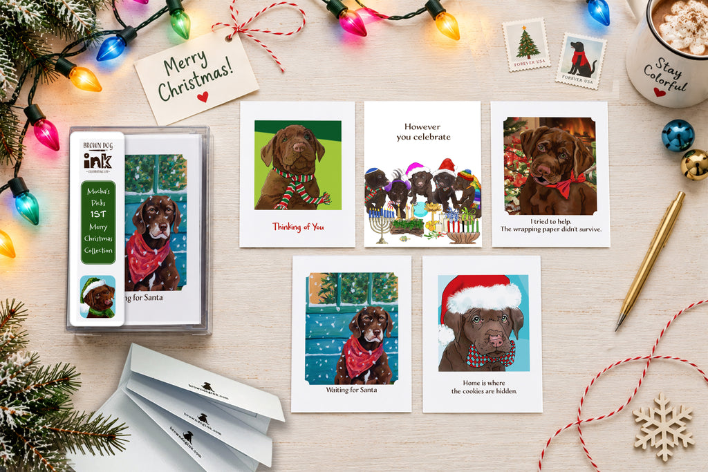 Brown Dog Ink Christmas dog greeting card collection featuring original artwork by Susan J. York, with five festive illustrated cards and collection packaging.