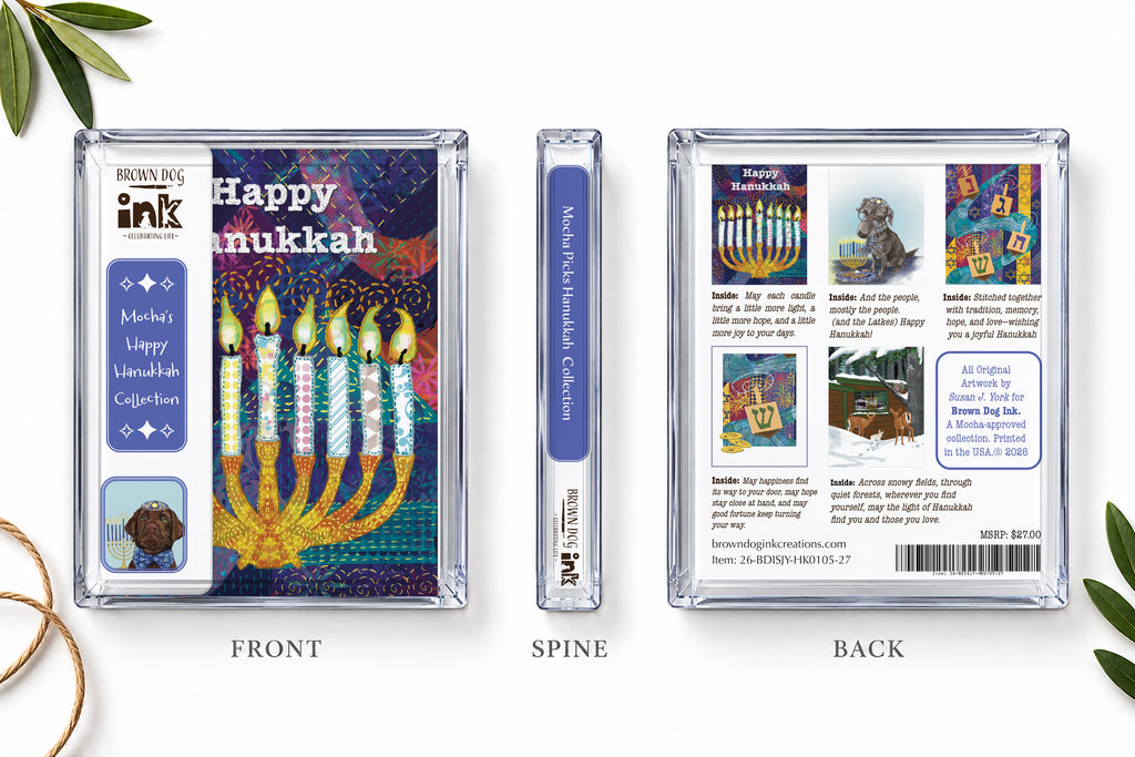 Front, spine and back views of Mocha’s Happy Hanukkah five-card collection in a clear Brown Dog Ink box, showing the colorful menorah cover and all five illustrated card designs. Original artwork by Susan J. York.