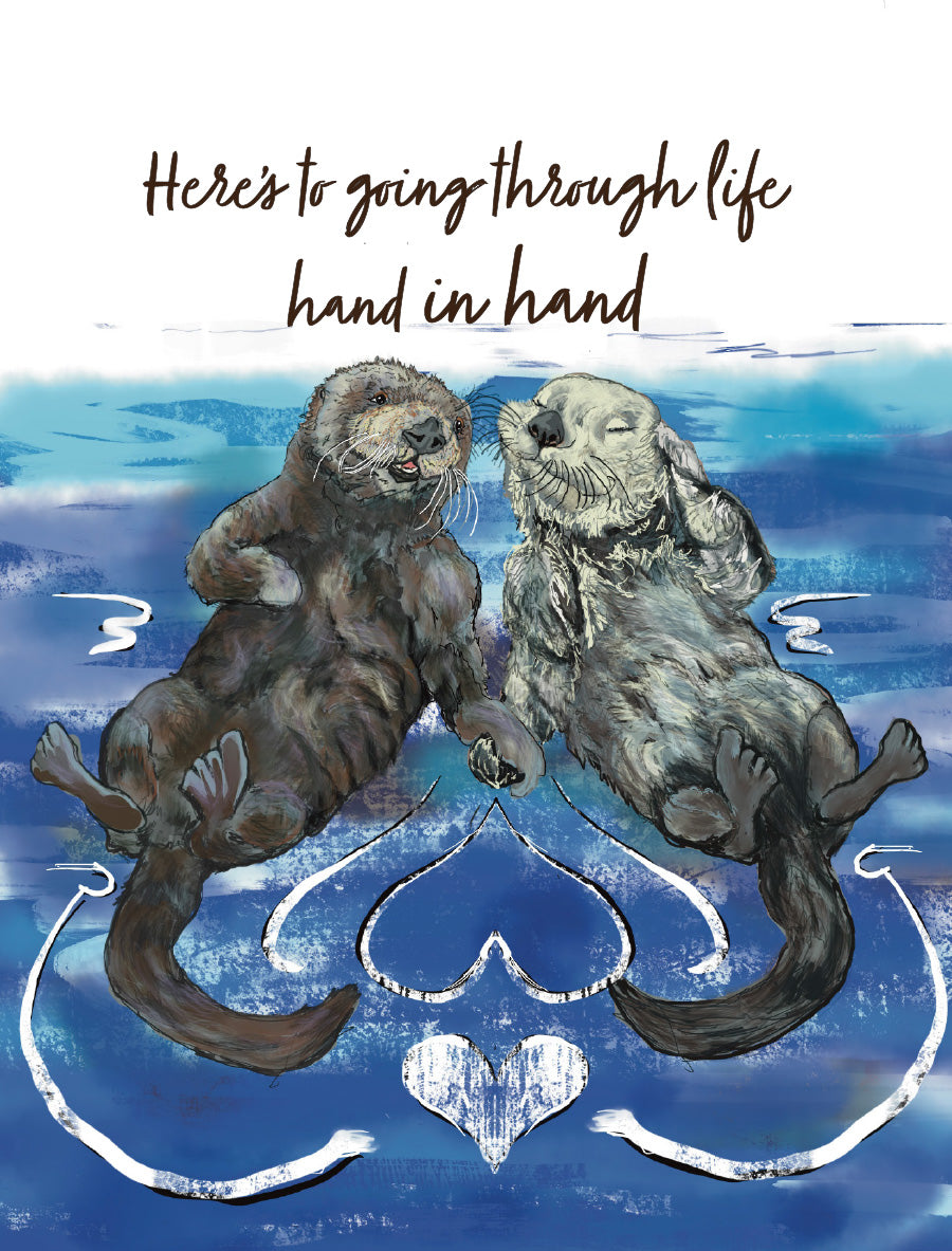 Illustrated wedding card by Susan J. York featuring two otters floating and holding hands, with the message “Here’s to going through life hand in hand.”