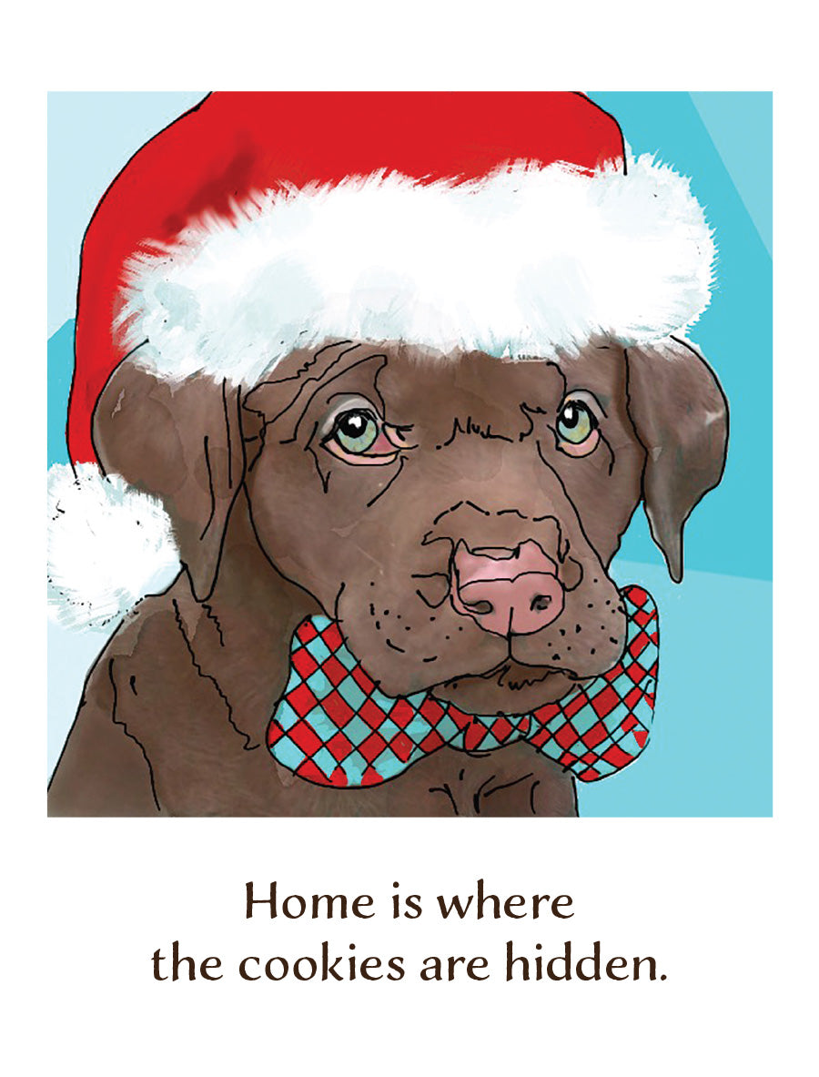 A Christmas-themed dog illustration with a brown dog wearing a red Santa hat with white trim and a red-and-blue checkered bow tie, above the text 'Home is where the cookies are hidden.' Original artwork by Susan J. York.