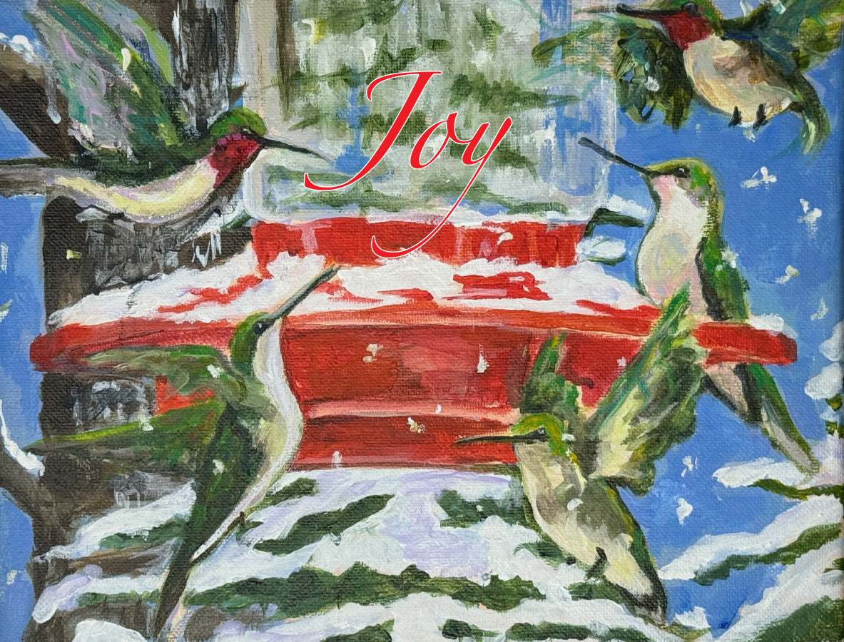 Original painting by Susan J. York of hummingbirds gathered around a red feeder in a snowy winter scene, with the word “Joy” in red.