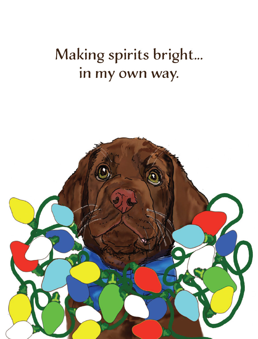 Humorous Christmas dog greeting card featuring original artwork by Susan J. York of a brown puppy tangled in colorful Christmas lights, with the message “Making spirits bright… in my own way.”
