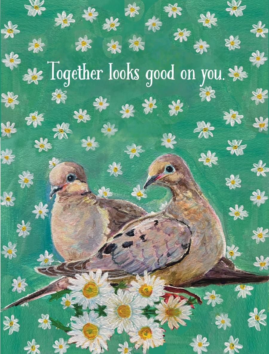 Illustrated wedding card by Susan J. York featuring two doves surrounded by white daisies, with the message “Together looks good on you.”
