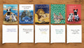 Five illustrated Wedding Celebration cards by Susan J. York shown with their exterior artwork and interior messages on a wood tabletop for Brown Dog Ink.